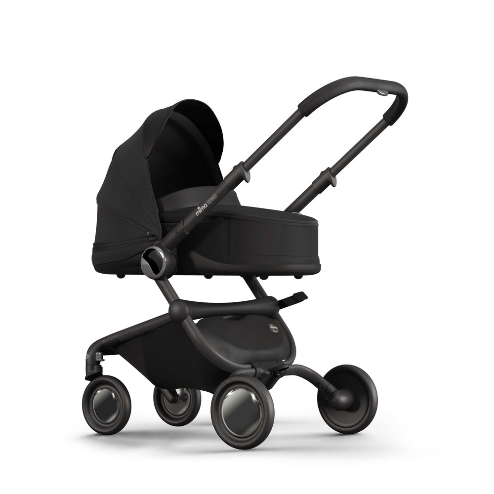 Black Mima Creo bassinet for newborns, left front view, compatible with the Mima Creo stroller.