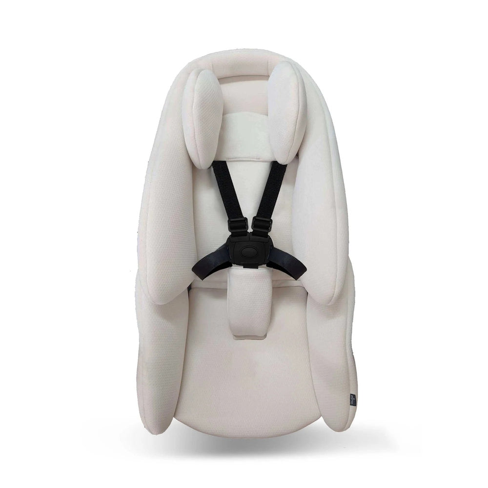 Mima Creo newborn snuggle infant insert in ivory fabric with black harness straps