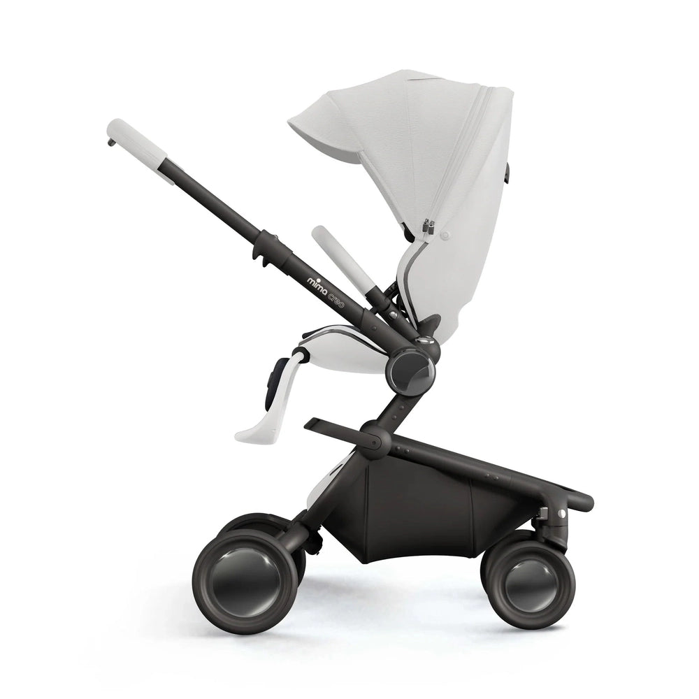 Mima Creo Stroller in white seat and black frame with extended canopy, being pushed on large wheels