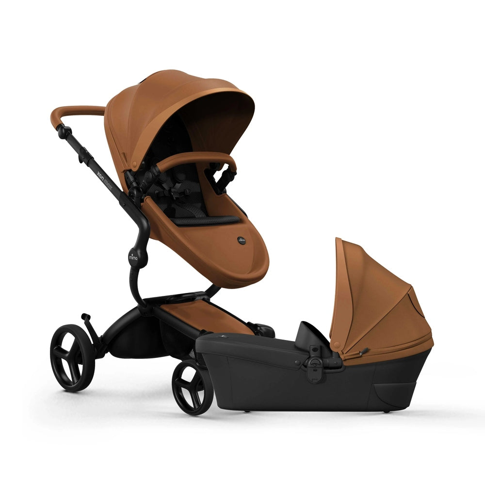 Mima Xari Max Stroller & Bassinet in brown leatherette with canopy and black chassis, bassinet module beside.