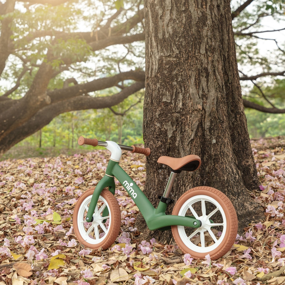 Mima Zoom Lite Balance Bike in Green park scene