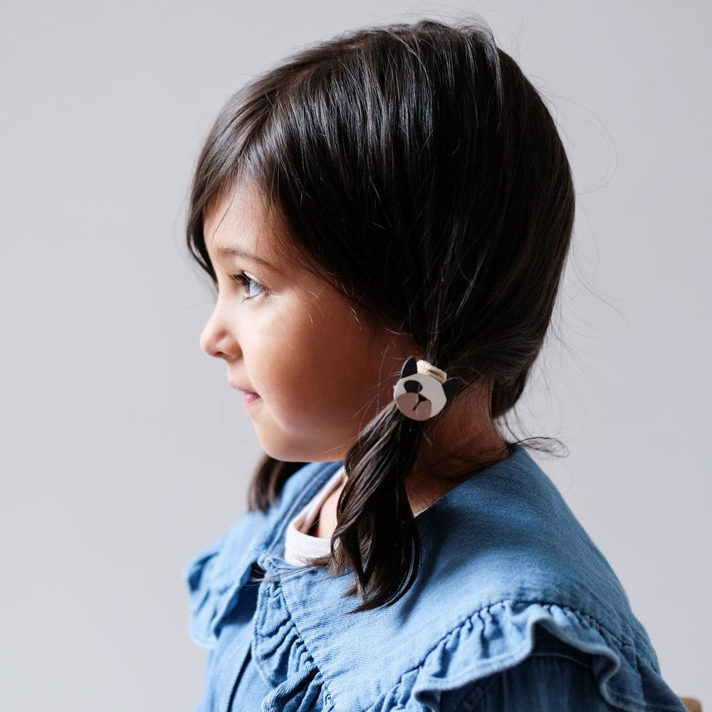 Mimi & Lula Doggy Pony hair clips in caramel on a dark-haired girl with a ponytail