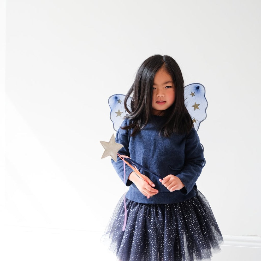 Mimi & Lula Midnight Tutu Navy: girl wearing navy tulle tutu with starry fairy wings and wand.