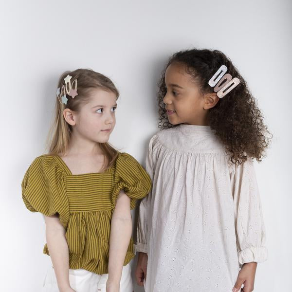 Mimi & Lula Shimmer Resin Clips; white translucent resin hair clips worn by two girls