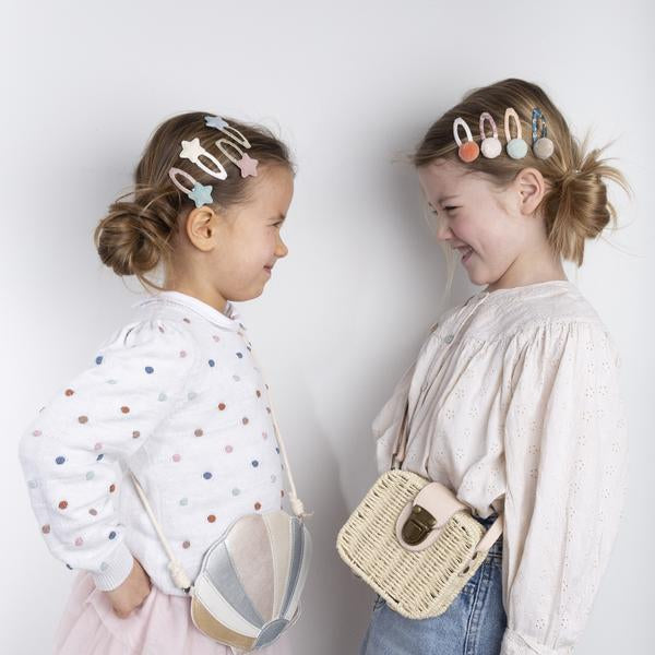 Mimi & Lula Shimmer Shell Bag in striped shell and woven straw styles, two bags shown.