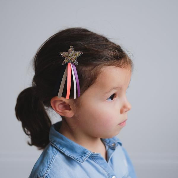 Mimi & Lula Shooting Star Clips on a girl; glitter star with pink and purple ribbons.
