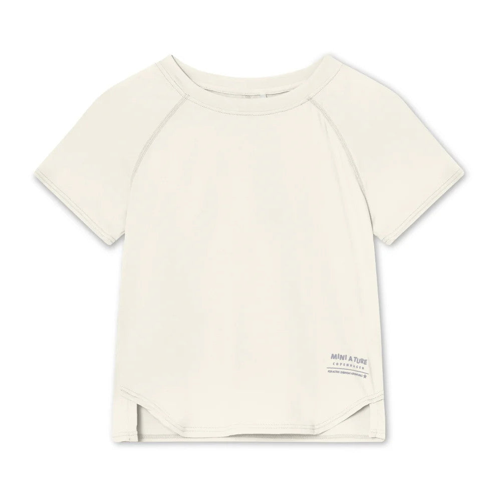 MINI A TURE Matbjergi T-Shirt Papyrus White laid flat on cream background, showing short sleeves, neat stitching, and hem label.