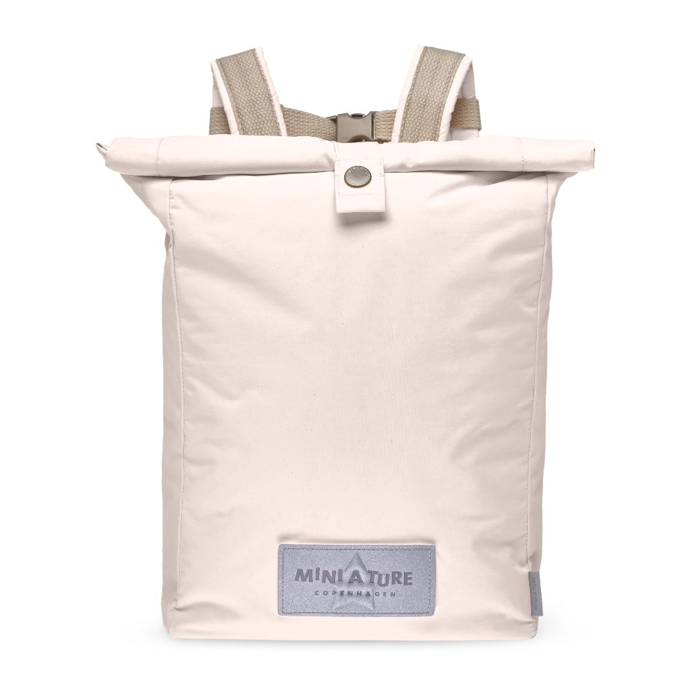 MINI A TURE Matwp Backpack Grs in light pink with beige straps, rolled top secured by snap.