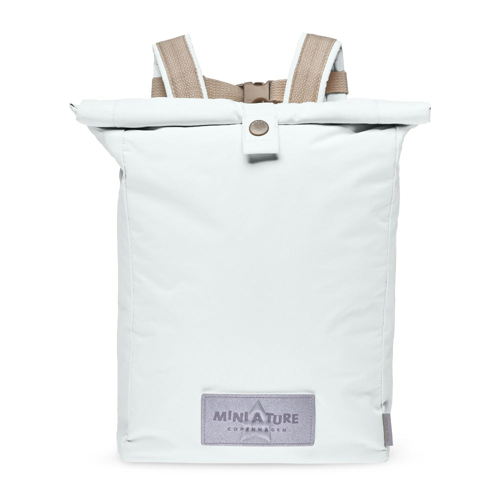 Mini A Ture Matwp Backpack Grs in pale mint with rolled top, beige padded straps shown secured by a metal buckle.