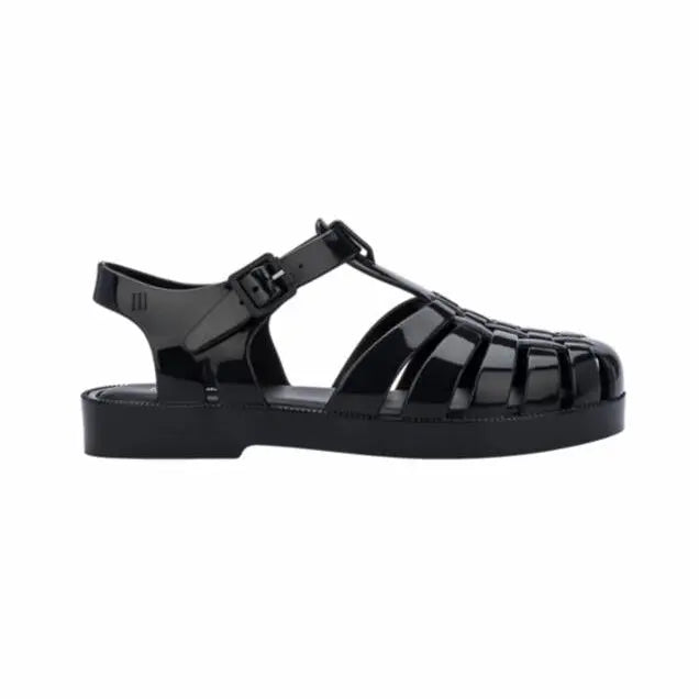 MINI MELISSA Mini Melissa Child Possession Sandal in black glossy jelly straps buckled at the ankle for a secure fit.