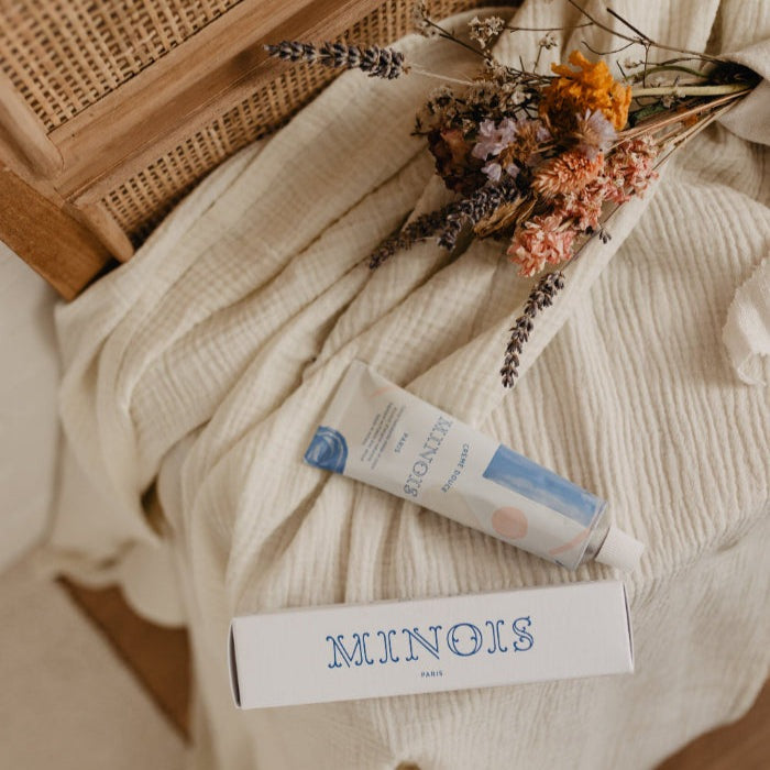 Minois Paris face and body cream 100 ml tube with box on beige blanket and dried flowers
