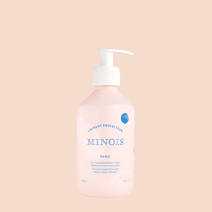Minois Paris Liniment Protector 300 ml bottle with white pump and pink liquid