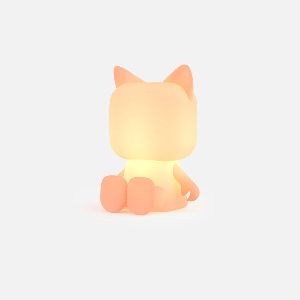 Mob Animal Light cat-shaped night light in peach with a warm glow, MOB brand.