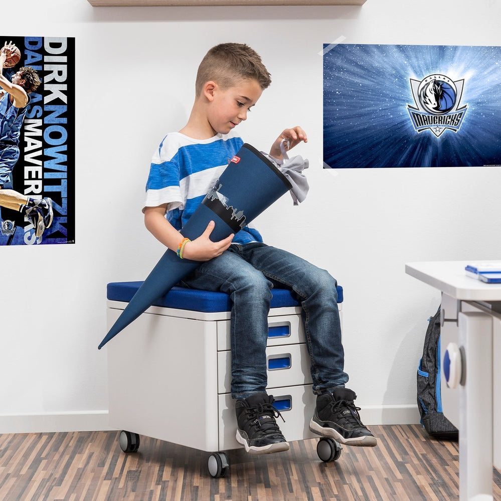 Moll Champion Cubic storage unit with blue cushion on a white wheeled cabinet.