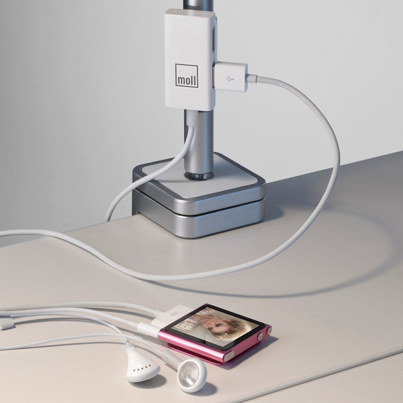 Moll FlexLight desk lamp with white USB adapter and pink iPod nano on desk