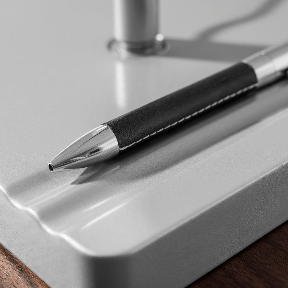 Moll L7 designer LED desk lamp with black leather-wrapped body and chrome tip