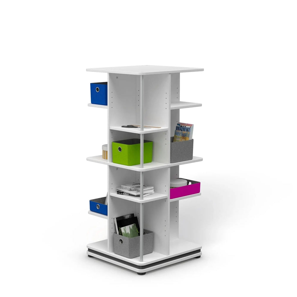 MOLL Rotating Shelf Tower 56 in white with blue/green/gray bins and magazines, rotating for easy access.