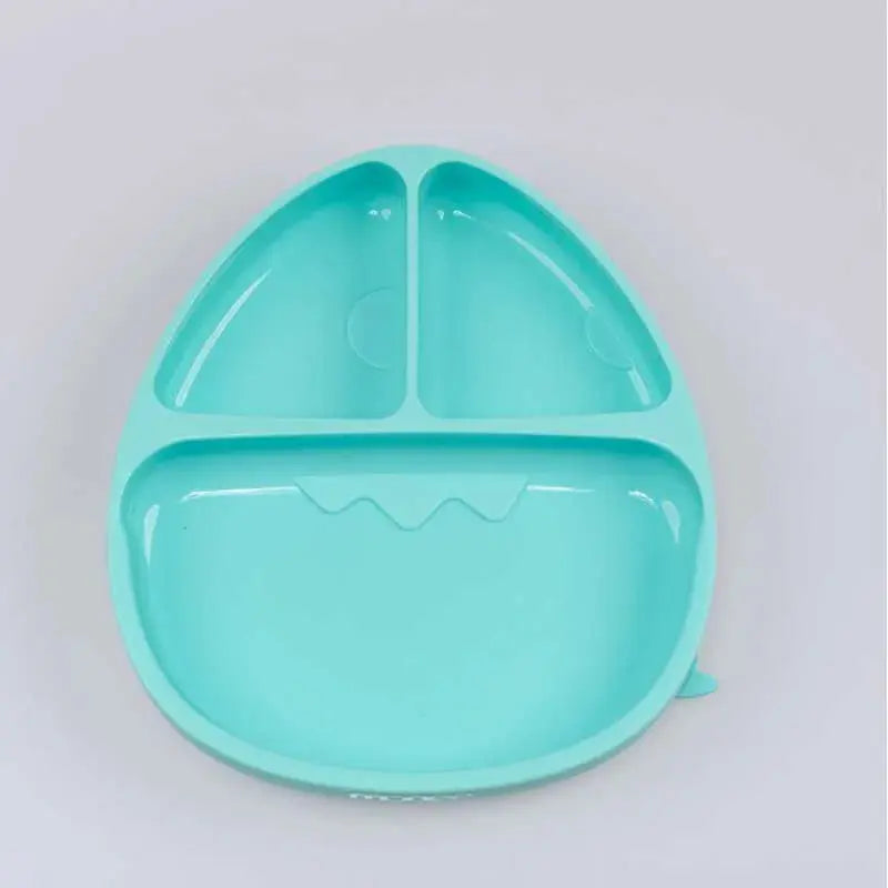 MONEE Dinosaur Food Plate Combo in turquoise, showing a three-compartment toddler plate shaped like a dinosaur face.