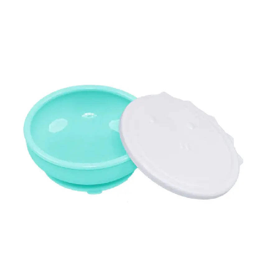 Monee Dinosaur Suction Bowl, turquoise with white lid, shown ready for mess-free feeding.