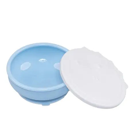Monee Dinosaur Suction Bowl, blue with white lid, shown secured to a tray by its suction base.