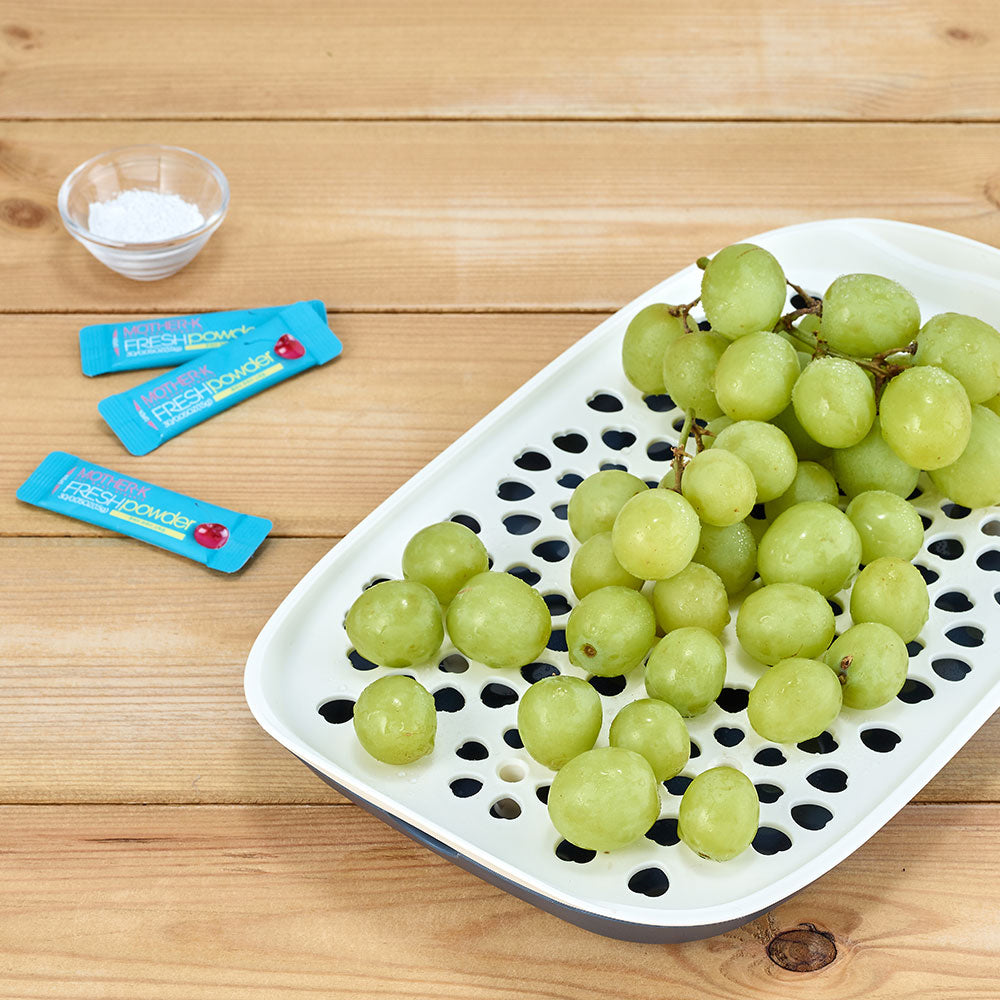 Mother-K Navy drying rack with white perforated tray on wooden surface