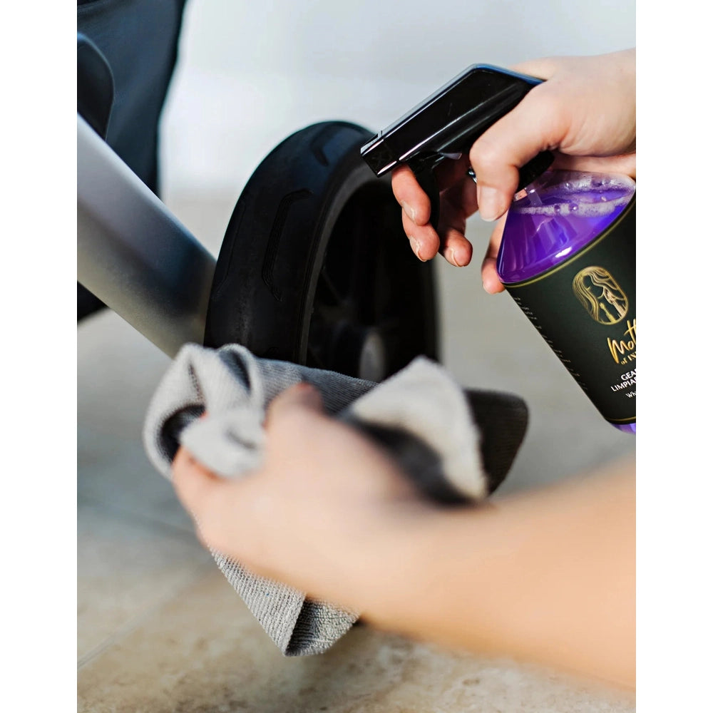 Mother Of Invention 500 ml multi-purpose cleaner being sprayed on a car wheel with a cloth