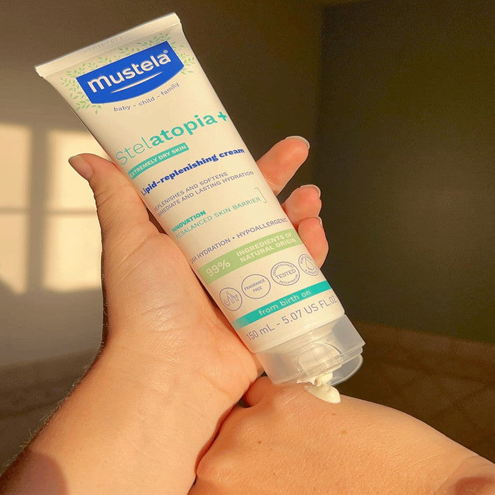 Mustela Stelatopia Lipid Replenishing Cream tube, 150 ml, blue-green packaging for baby skin
