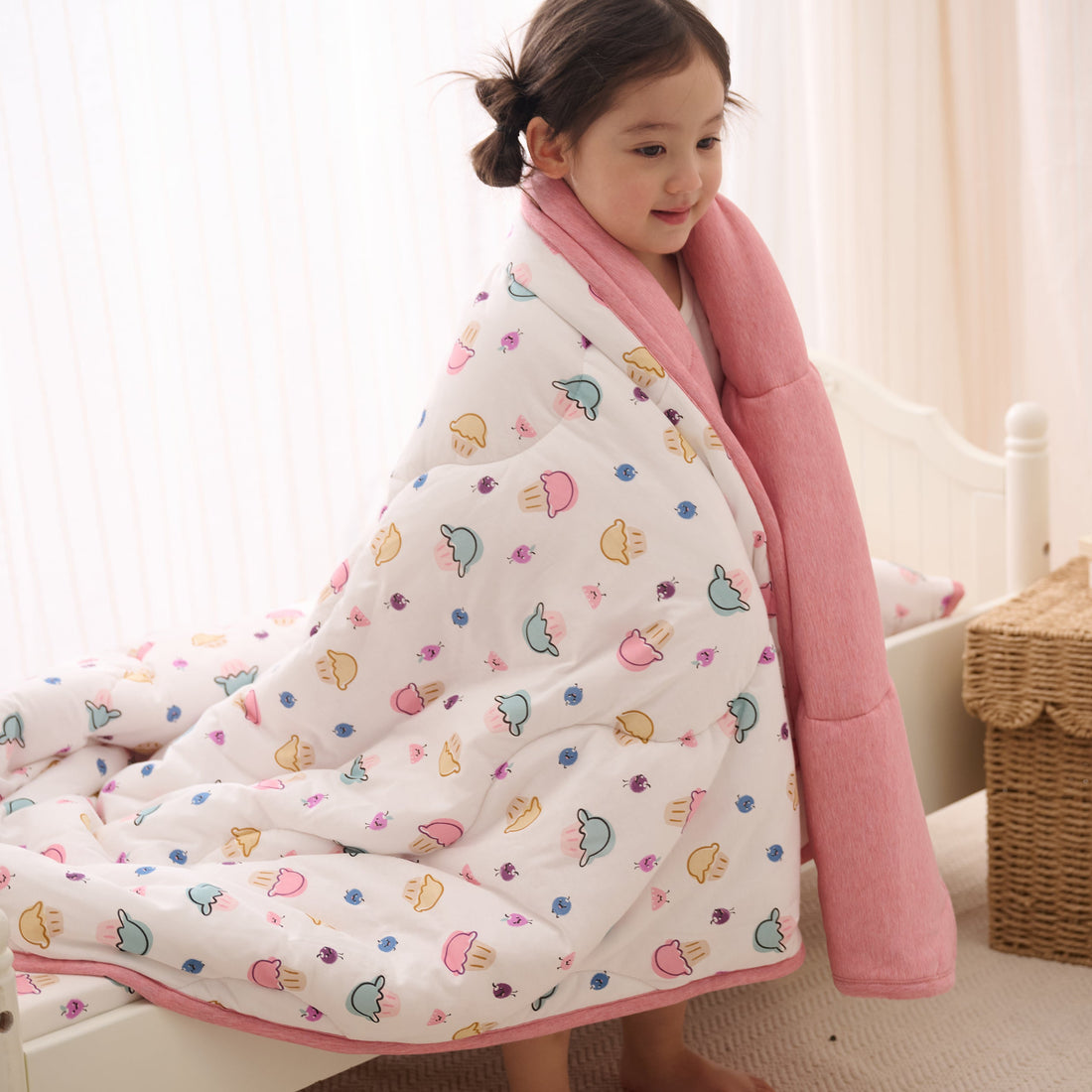 Nest Designs Winter Cozy Twin Blanket in Muffin Man wrapped around a child