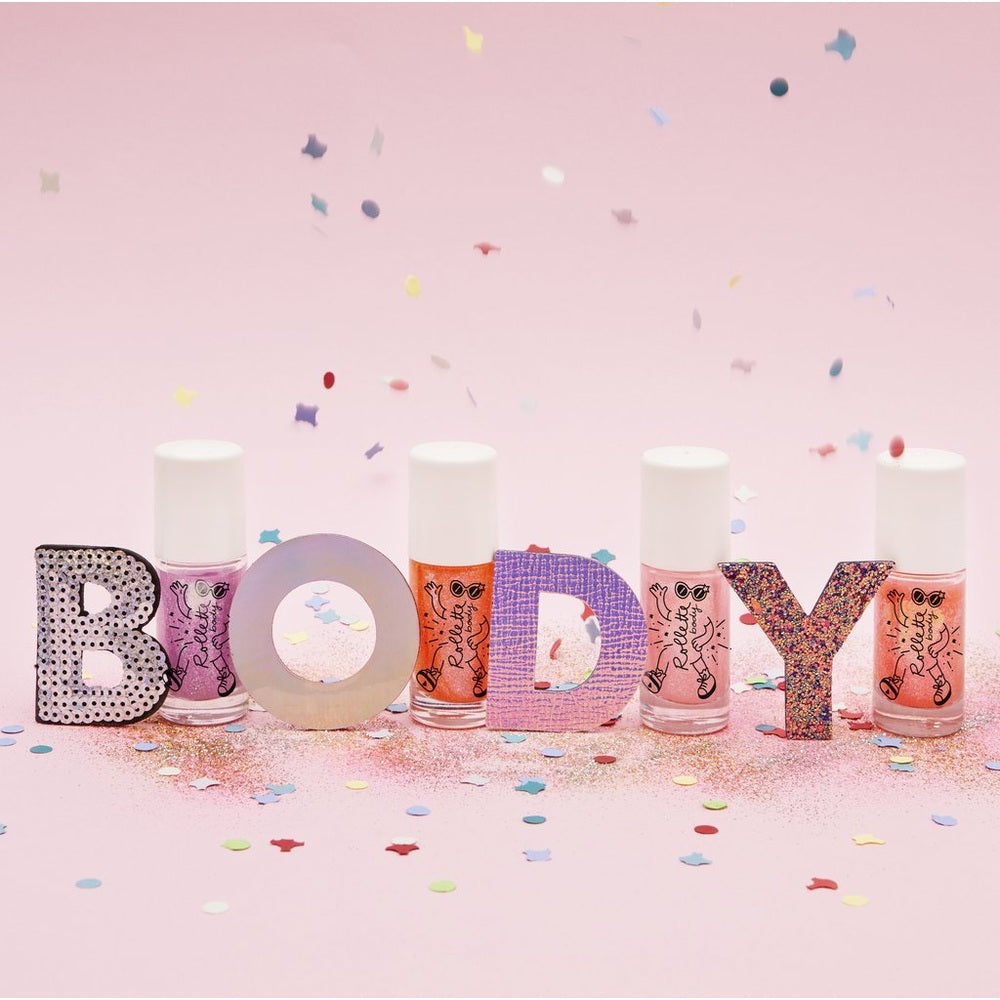 Nailmatic Body Rollette Cherry Body Gel displayed with glittery BODY letters and confetti on pink background.