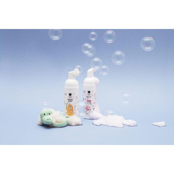 Nailmatic Mousse Party Apricot Hair & Body Foam bottles (2) with bubbles and a plush toy.