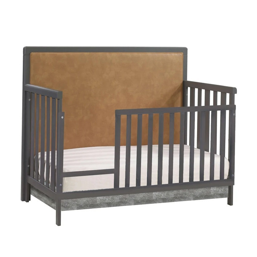 Natart Kyoto toddler bed with gray guard rails and brown upholstered headboard