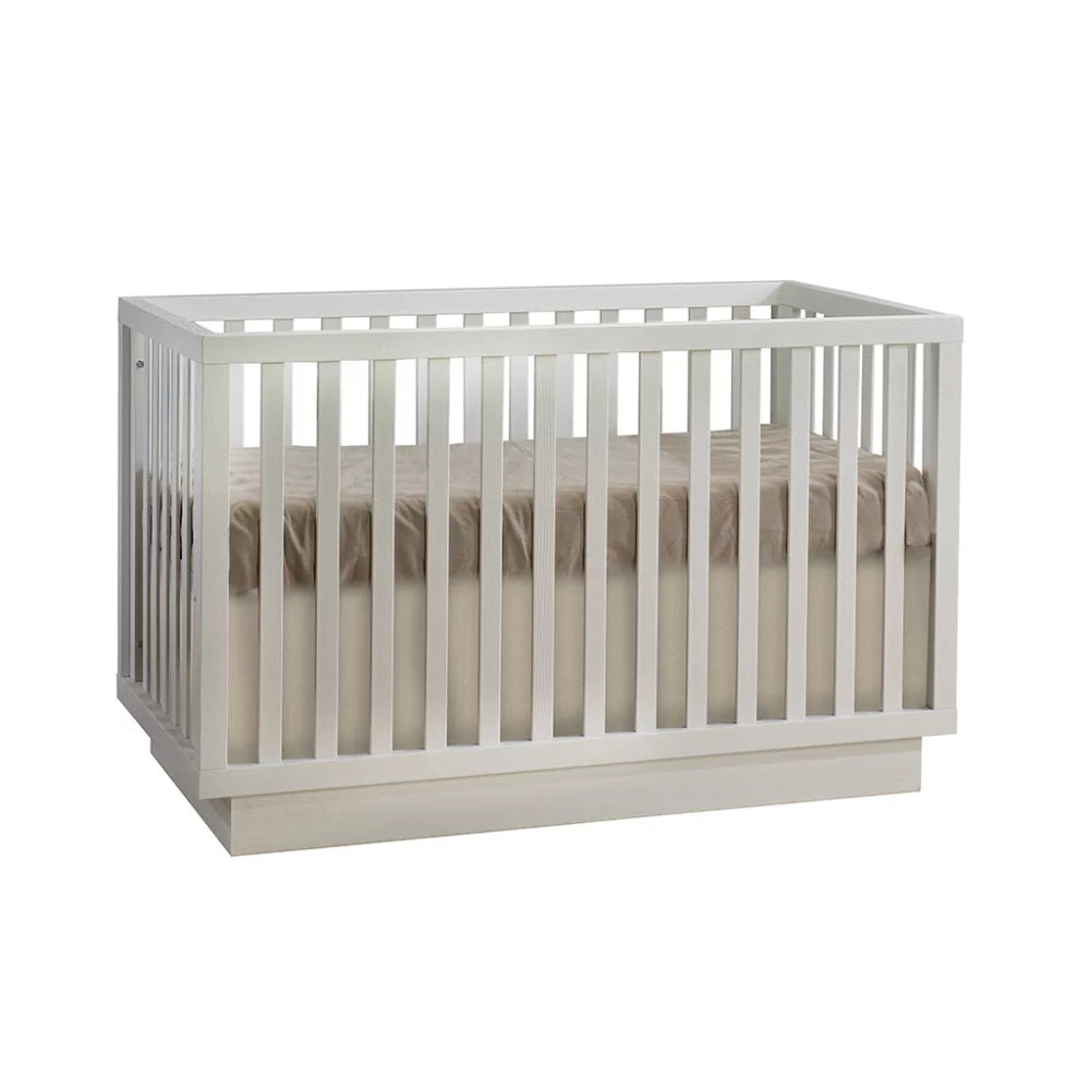 Natart Como Classic Convertible Crib by NATART in white with slatted sides and beige mattress
