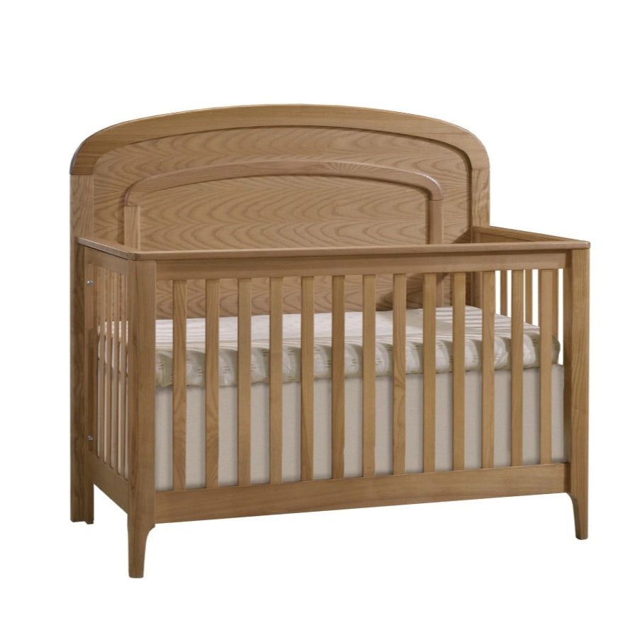 Natart Palo 5-in-1 convertible crib in natural wood with arched decorative molding