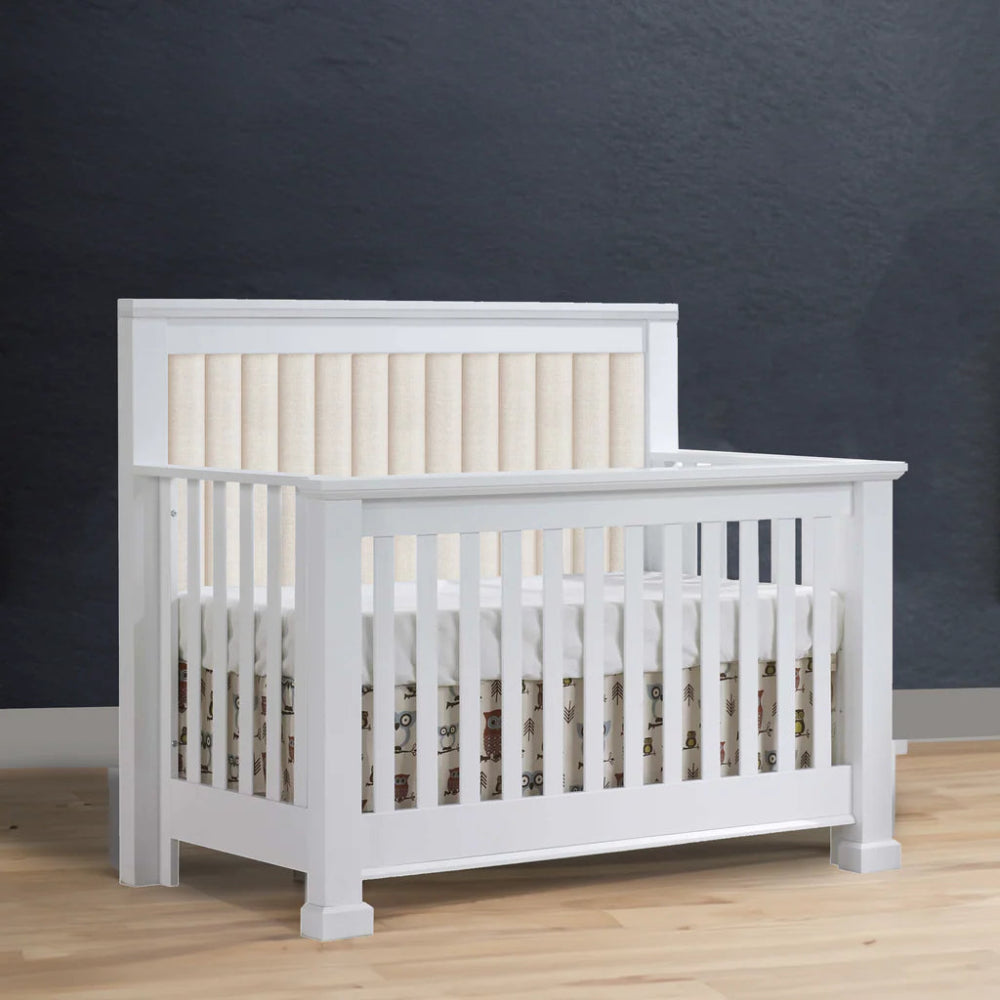 NATART Taylor 5-in-1 convertible crib in white with channel-tufted headboard panel