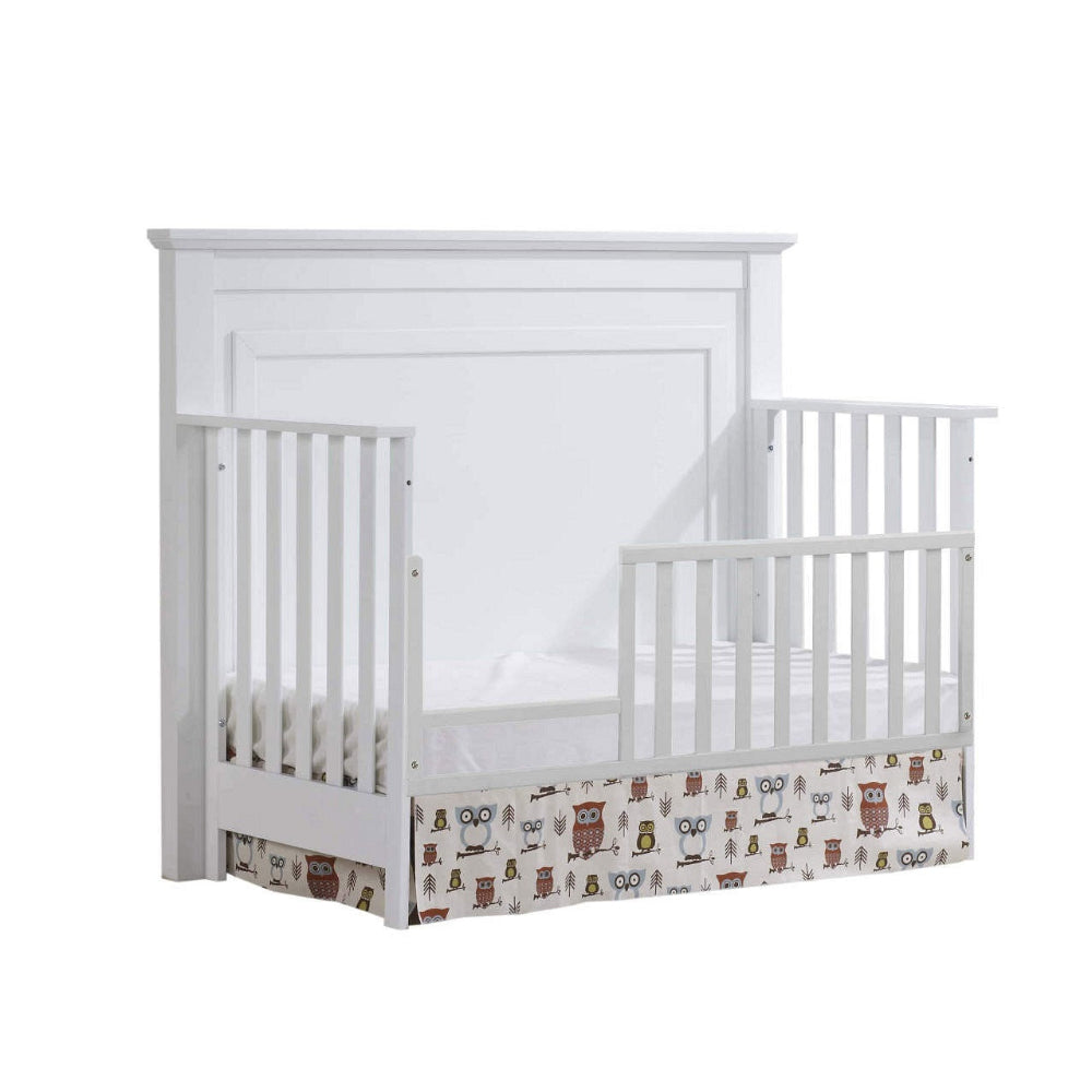 Natart Taylor toddler gate, white wooden gate with owl-pattern fabric storage panel at base