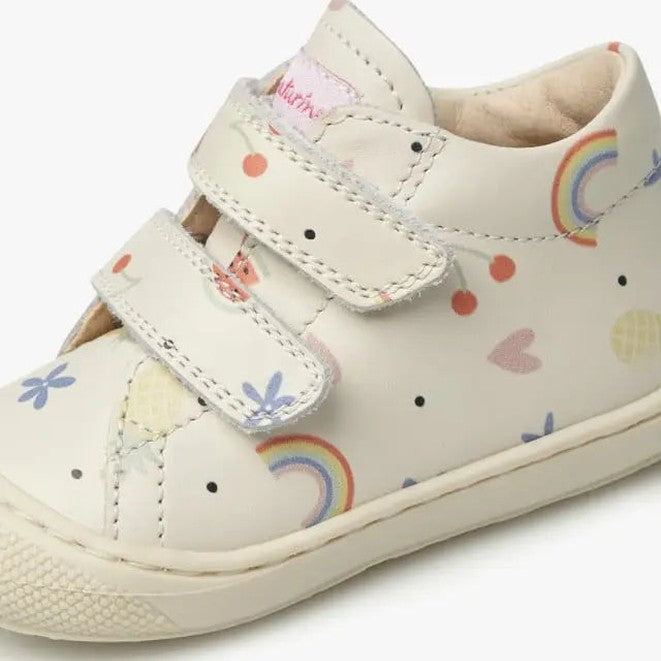 Naturino Cocoon Vl Cream toddler shoe; cream leather with two Velcro straps fastened, rainbow print.