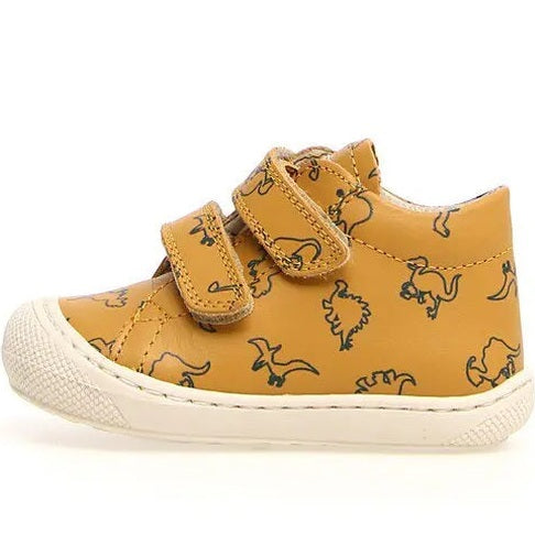 Naturino Cocoon Vl Dino toddler shoe in tan yellow with dinosaur print, two Velcro straps fastened, white sole