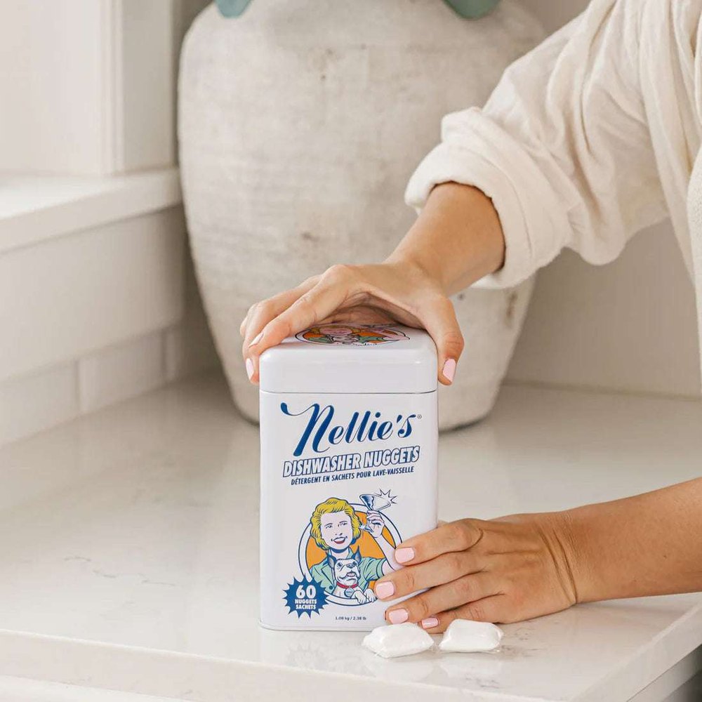 Nellie's Dishwasher Nuggets tin on counter, white canister with blue Nellie's logo, 60 sachets