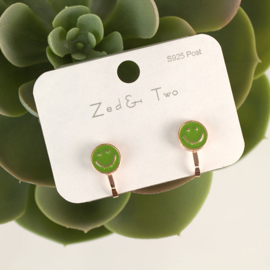 Nemibaby Smile earrings; bright green enamel smiley studs on S925 posts, shown as a pair.