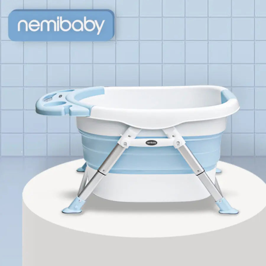 Nemibaby Foldable 4-in-1 Baby/Toddler Bathtub in blue and white with extended metal legs for stability.