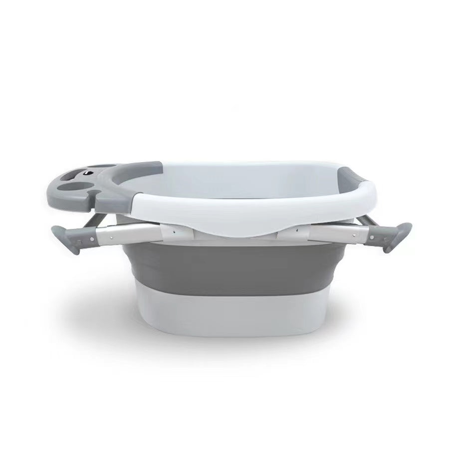 Nemibaby foldable baby/toddler bathtub in grey with white rim and built-in side supports