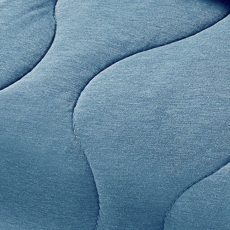 Nest Designs Avocado Bamboo Cozy Blanket Medium Captain's Blue draped over a surface, showing plush bamboo fabric.