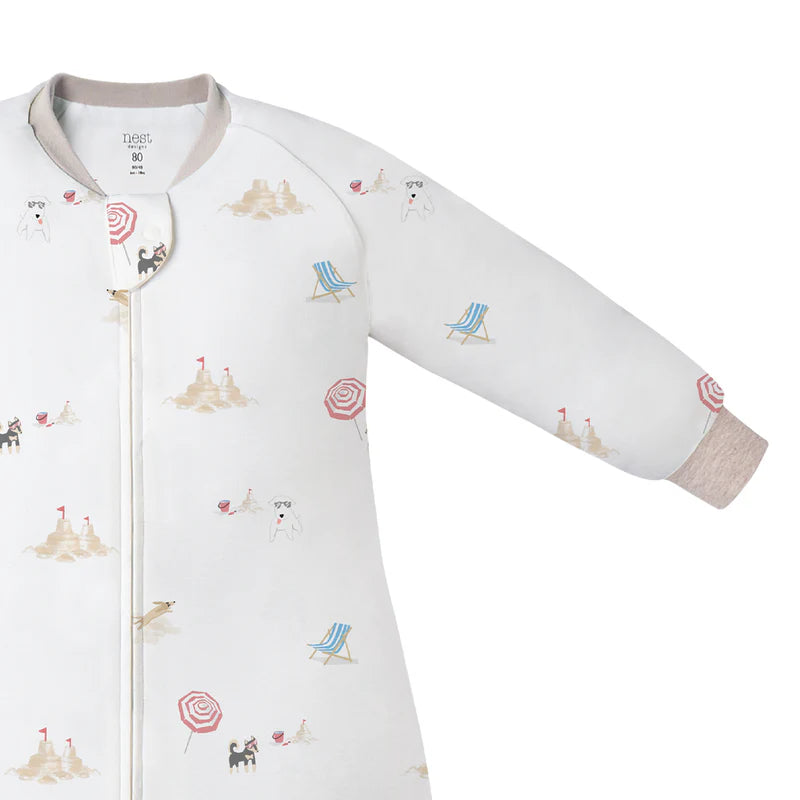 Nest Designs Avocado Bamboo Long Sleeve Footed Sleep Bag 1.0 Tog Beach Daze; white with beach-daze print and visible front zipper.