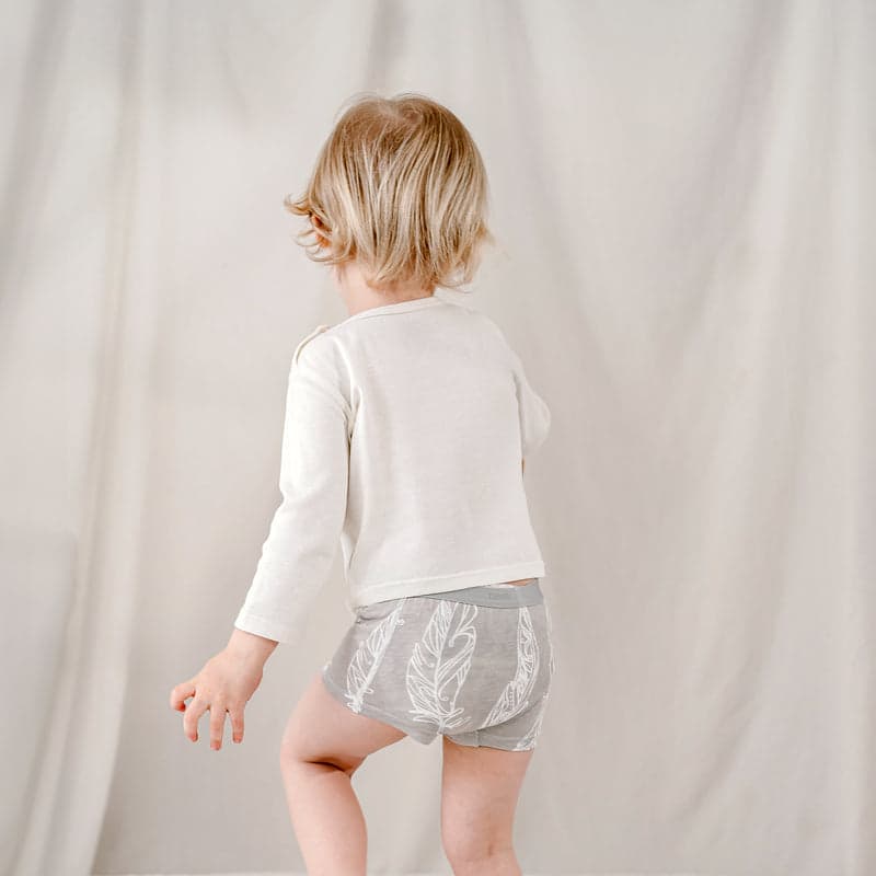 Nest Designs Bamboo Boys Boxer Briefs Underwear 2-Pack, gray with white feather print, toddler turning to show waistband