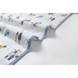 Nest Designs Bamboo Cotton Waterproof Change Pad Serengeti with light blue trim, laid flat to show waterproof fabric.