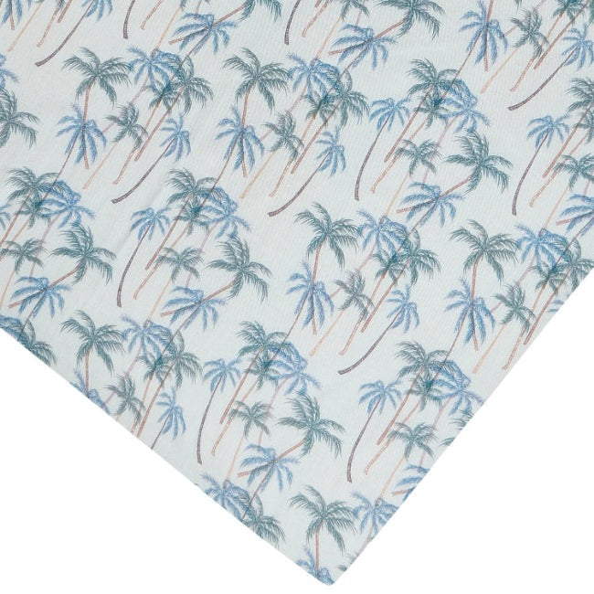 Nest Designs bamboo crib sheet Coco Beach with blue palm tree print