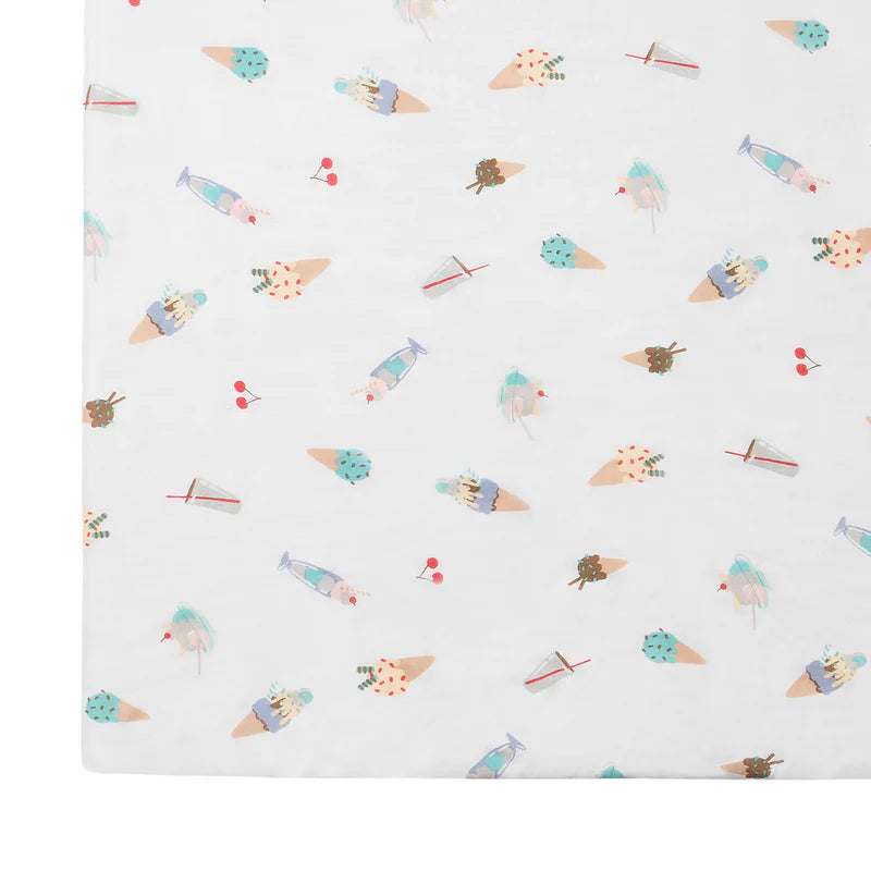 Nest Designs bamboo crib sheet with ice cream cone print on white background
