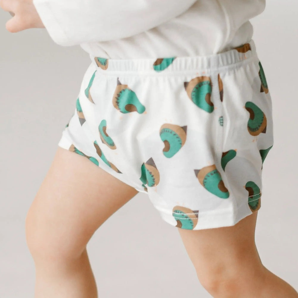 Nest Designs Bamboo Girls Boy Short Underwear 2-pack in teal/brown quail print, worn by child showing snug elastic-fit.