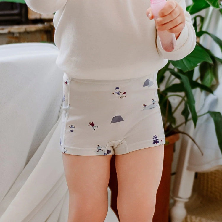 Nest Designs Bamboo Girls Boy Short Underwear (2 Pack) Snow Buddies; toddler wearing soft beige bamboo fabric with playful snow prints.