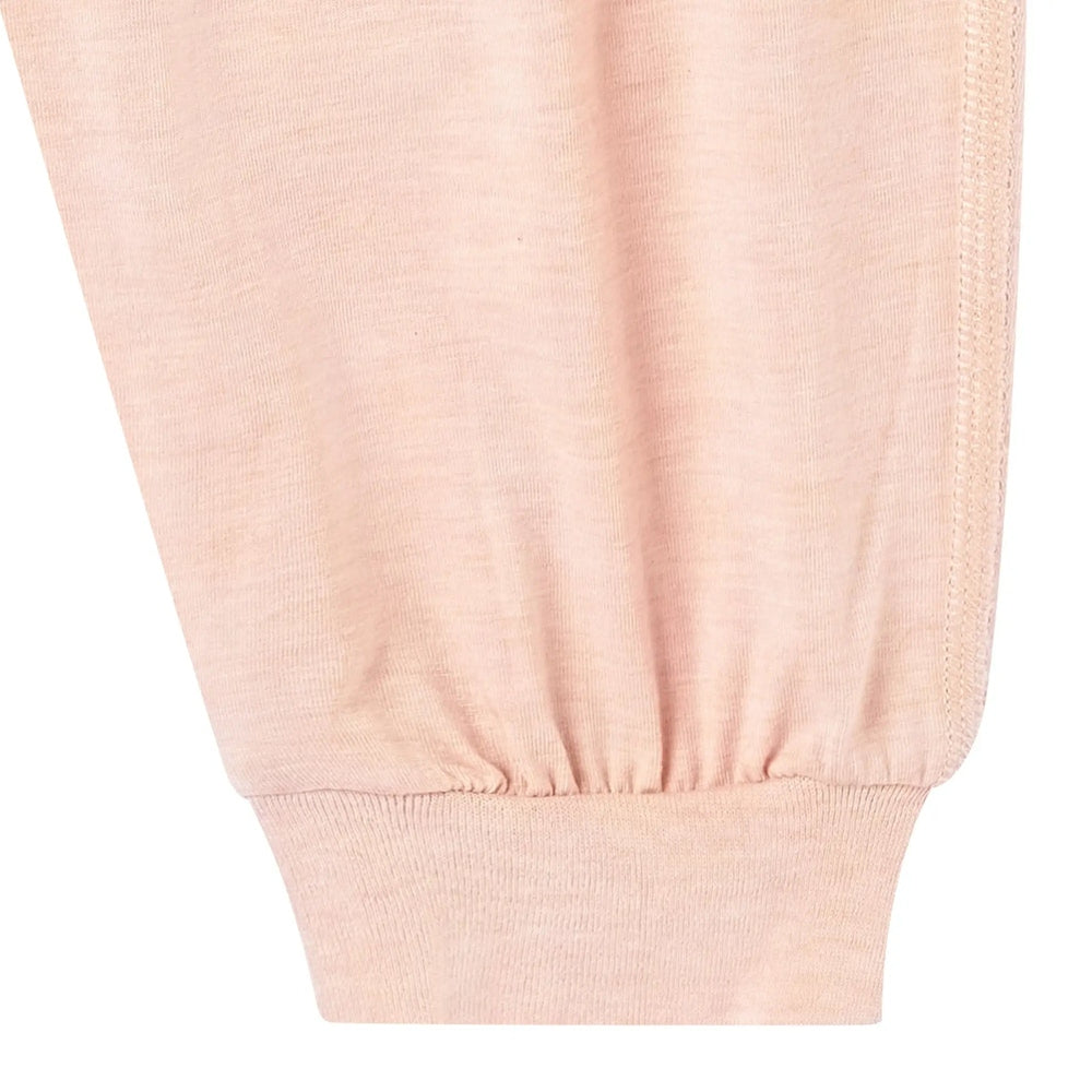 Nest Designs Bamboo Jersey Harem Pants Pantone Bellini in peach; close-up of soft knit fabric and elastic ankle cuff.
